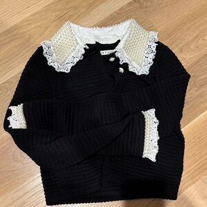 Like new !!! Alice and Olivia black sweater. pearl lace collar and cuffs. Small